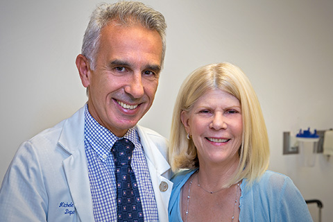 Patient Beth Oringher with Michele Tagliati, MD, director of the Movement Disorders Program