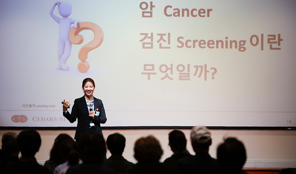 Dong Hee Kim, Community Outreach coordinator at the Cancer Research Center for Health Equity, conducting a cancer awareness workshop with community members at Los Angeles Onnuri Church in Koreatown. (2018)