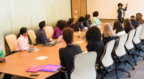 Large group of people in a meeting room.